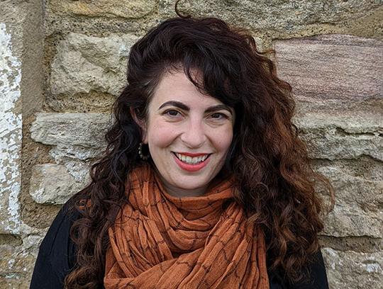 headshot of woman with long dark hair